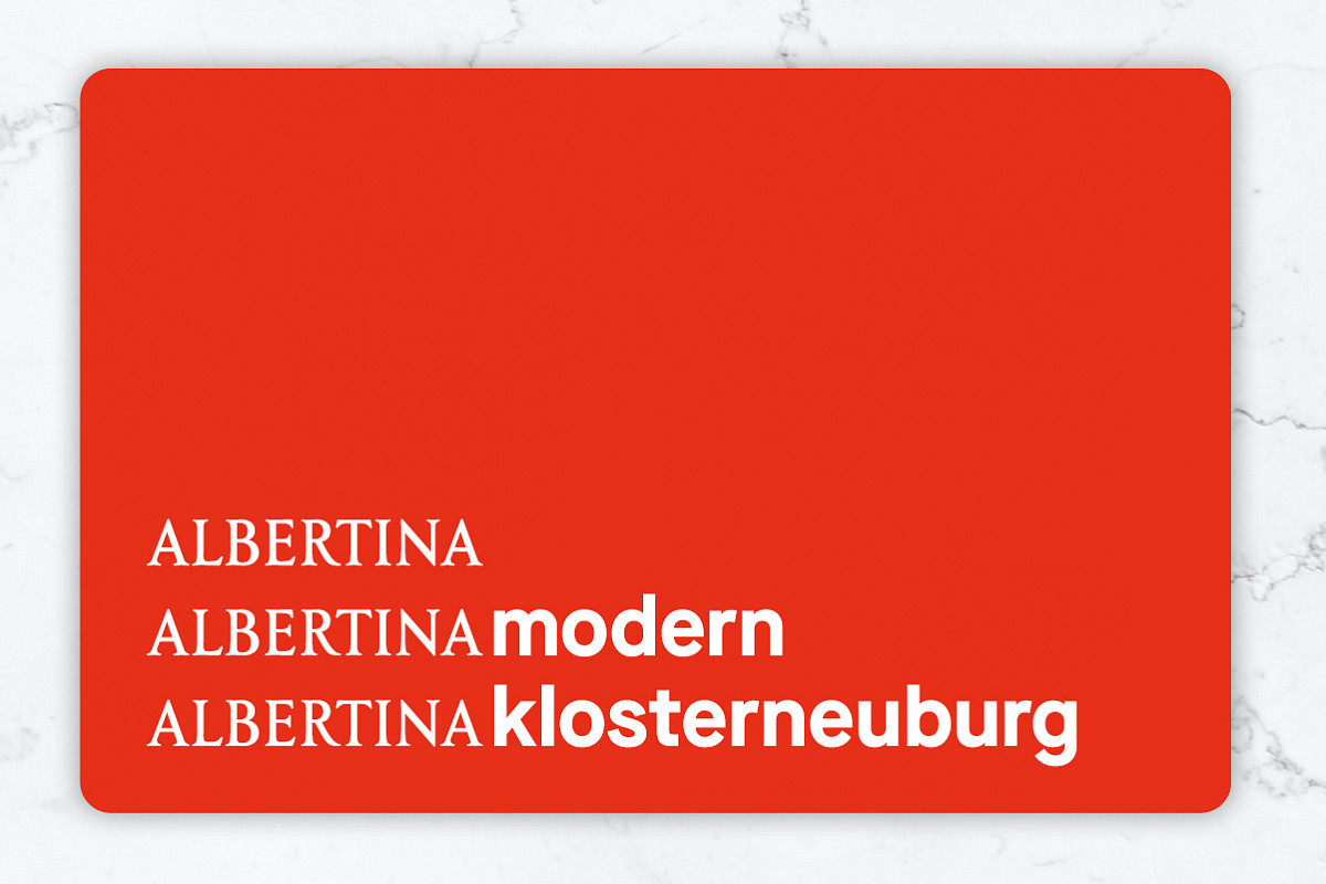 Picture of the annual ticket: red card with the inscription of the three locations (ALBERTINA, ALBERTINA MODERN, ALBERTINA KLOSTERNEUBURG) on a white background
