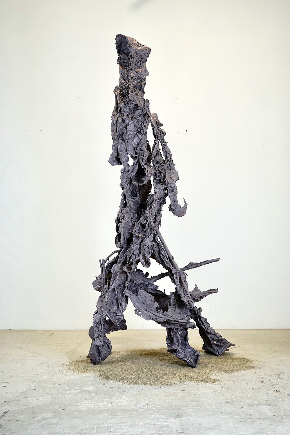 A sculpture that looks like a walking person.