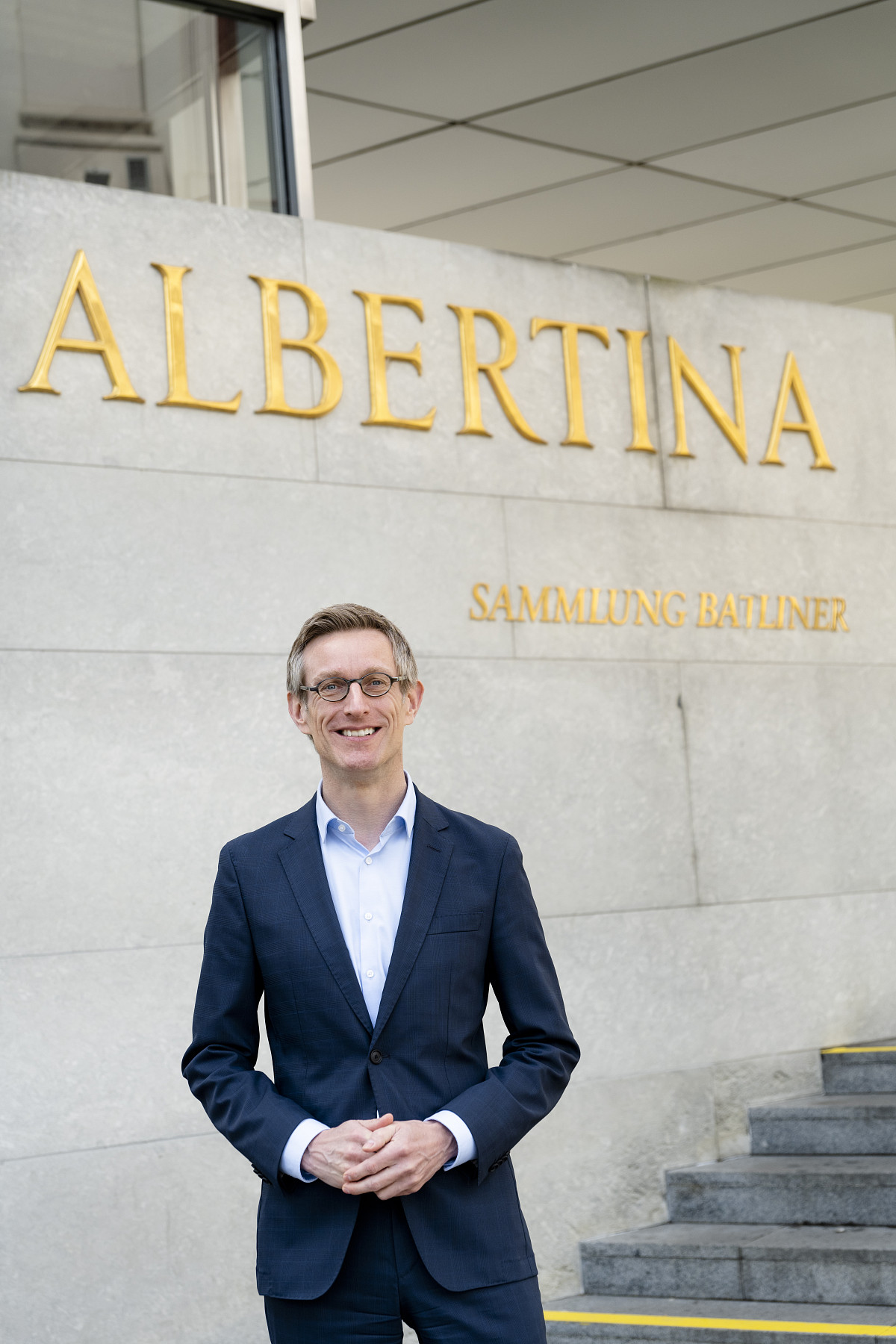 General Director Ralph Gleis stands in front of the entrance to the Albertina.