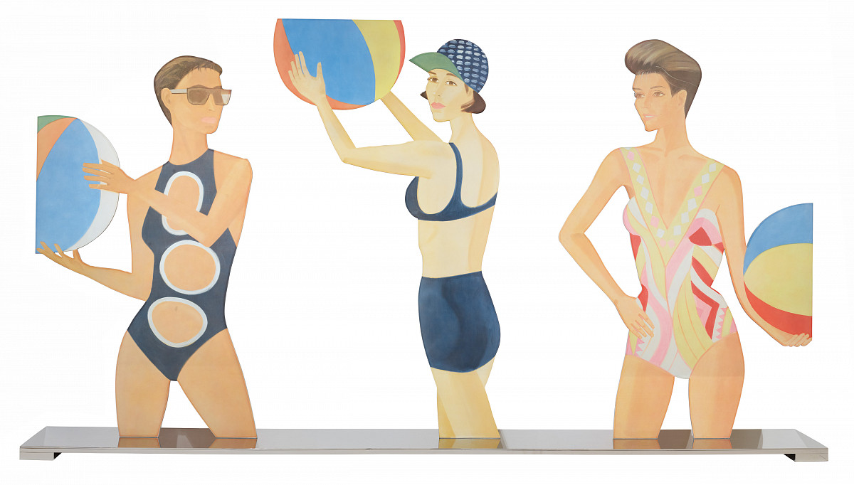 Three women in swimsuits, each holding a colorful beach ball.