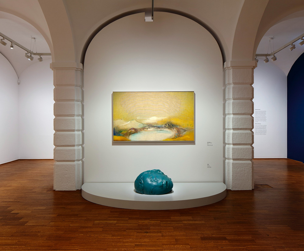 Exhibition view - a yellow artwork on a white wall