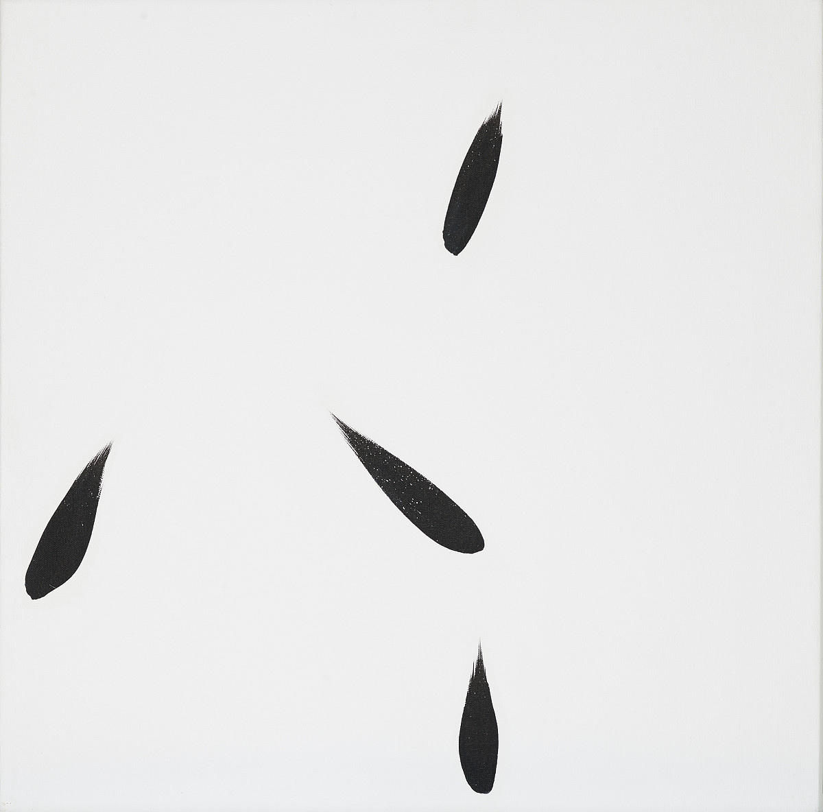 Four black drops on a white background.
