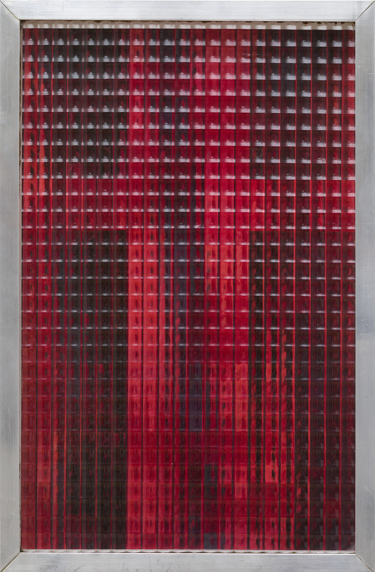 A red-and-black painting behind transparent, textured glass.